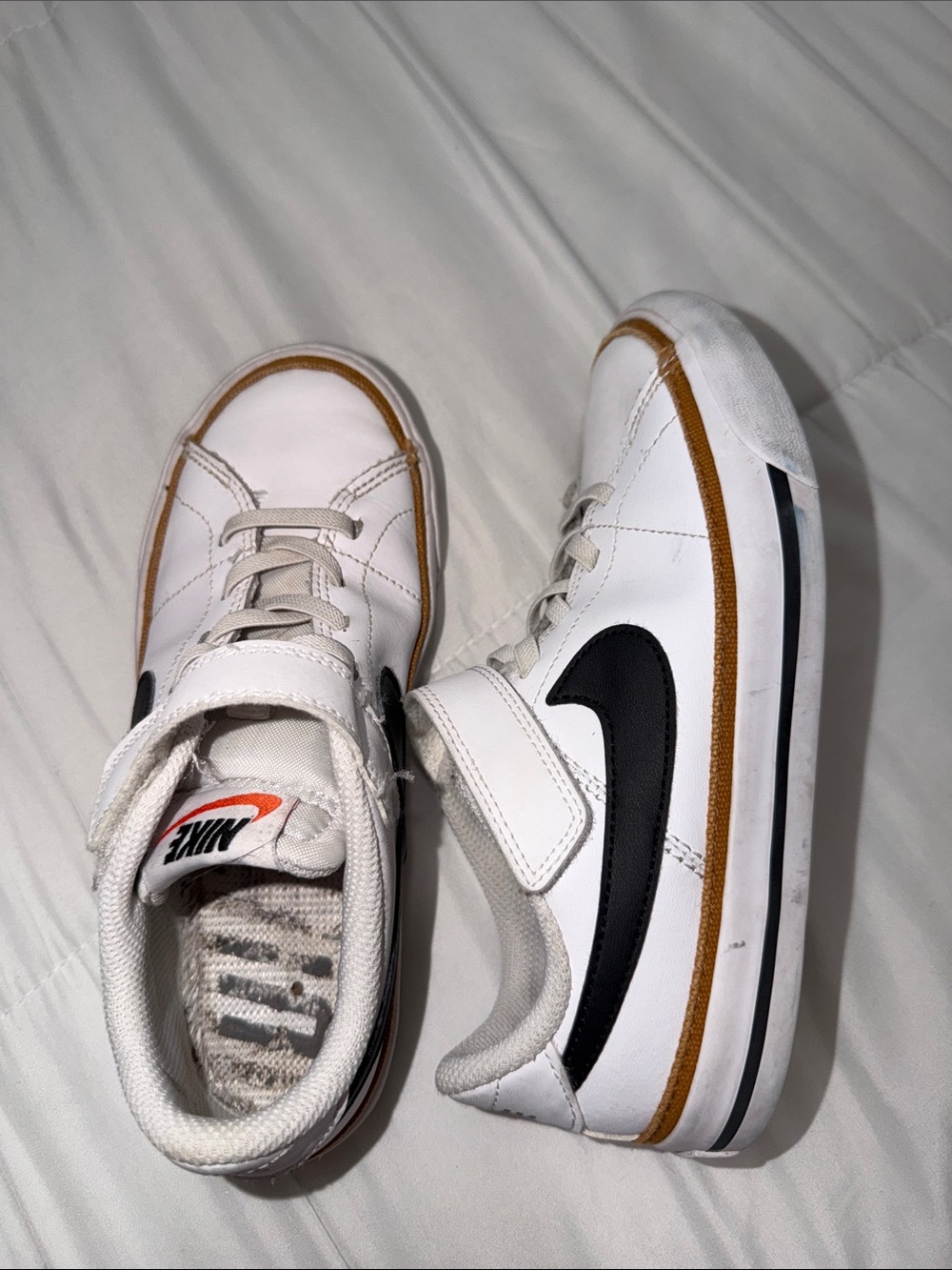 Nike White Kids Sneakers with Black Swoosh and Brown Trim
